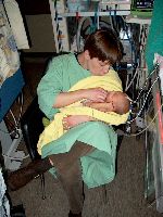 December 18, 2002 - In mammy's arms for the first time since birth